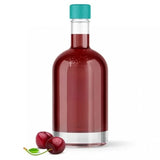 A clear glass bottle filled with dark red liquid, topped with a teal cap, shown on a white background with two red cherries at the base.